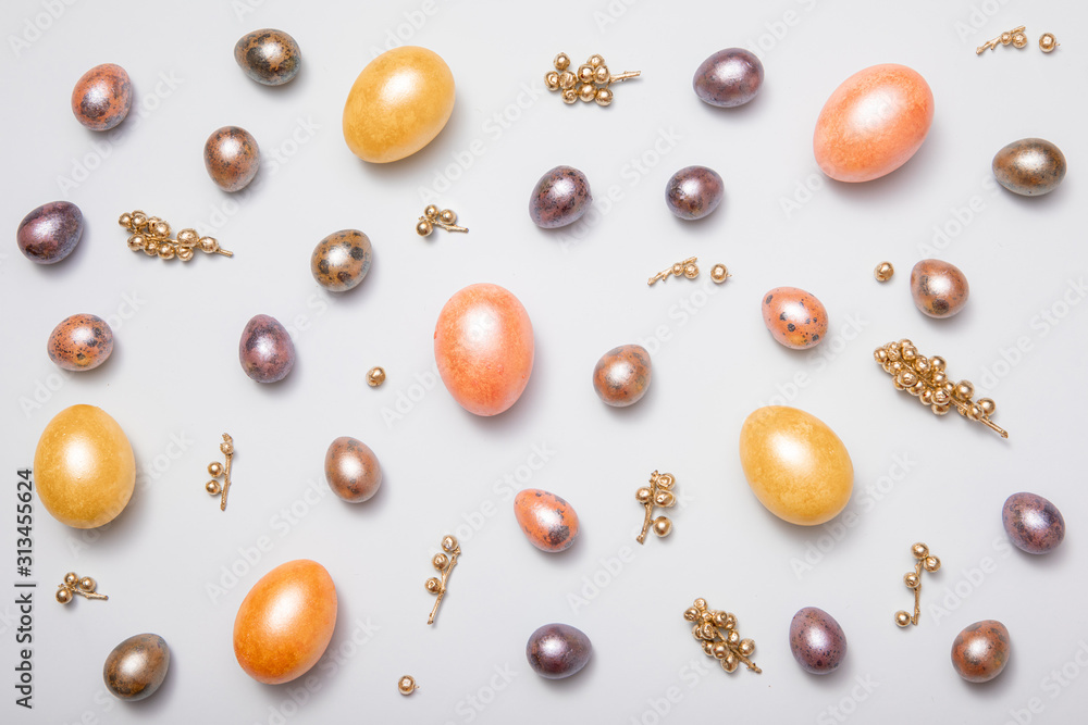 Layout of Easter eggs painted in pastel colors on a white background, top-down view Layout of Easter eggs painted in pastel colors on a white background, top-down view
