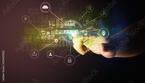 Hand touching FRAUD inscription, Cybersecurity concept