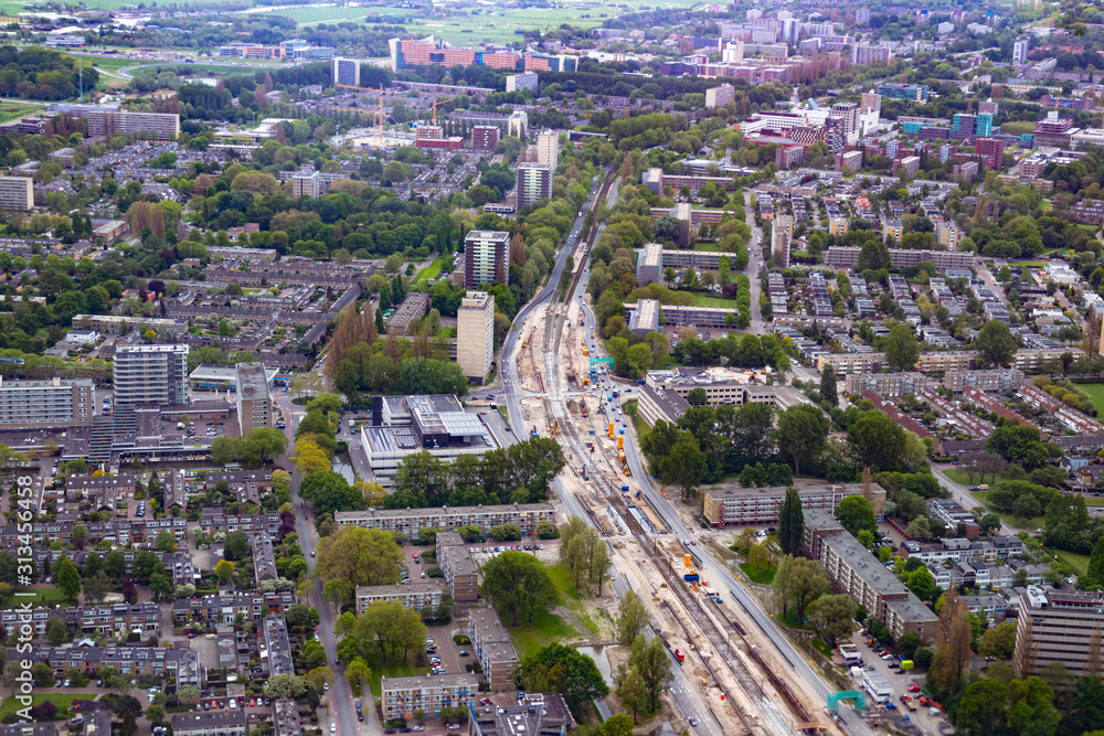 Aerial view of Amsterdam city outside Schiphol airport during flight landing