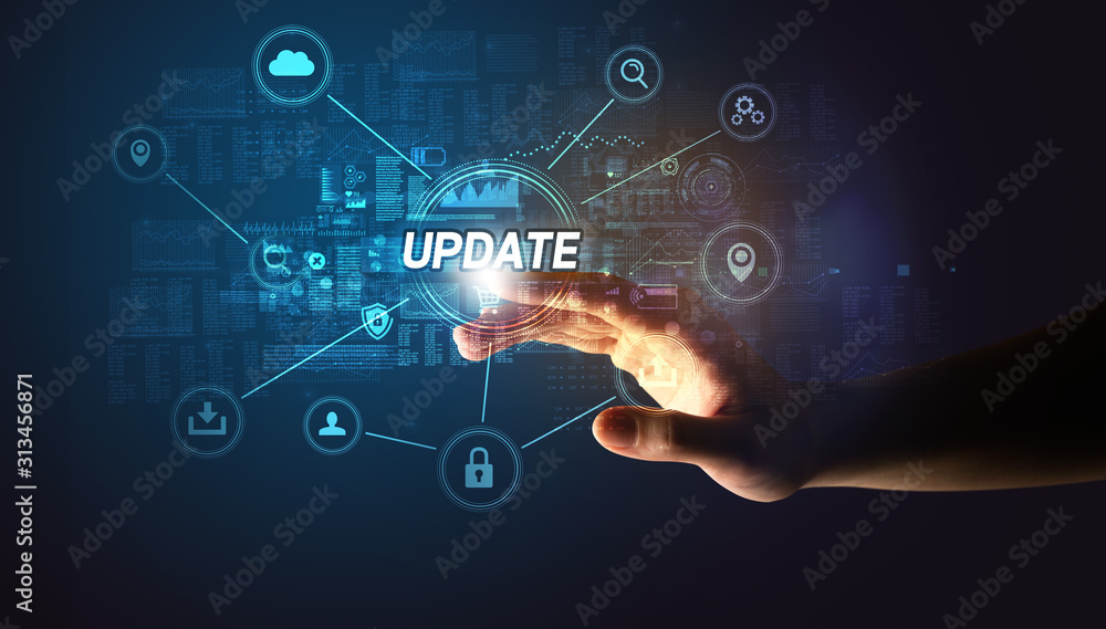 Hand touching UPDATE inscription, Cybersecurity concept Hand touching UPDATE inscription, Cybersecurity concept