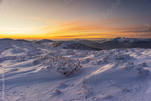 Mountain winter landscape in the Ukrainian Carpathians on the background of the sunset. © reme80