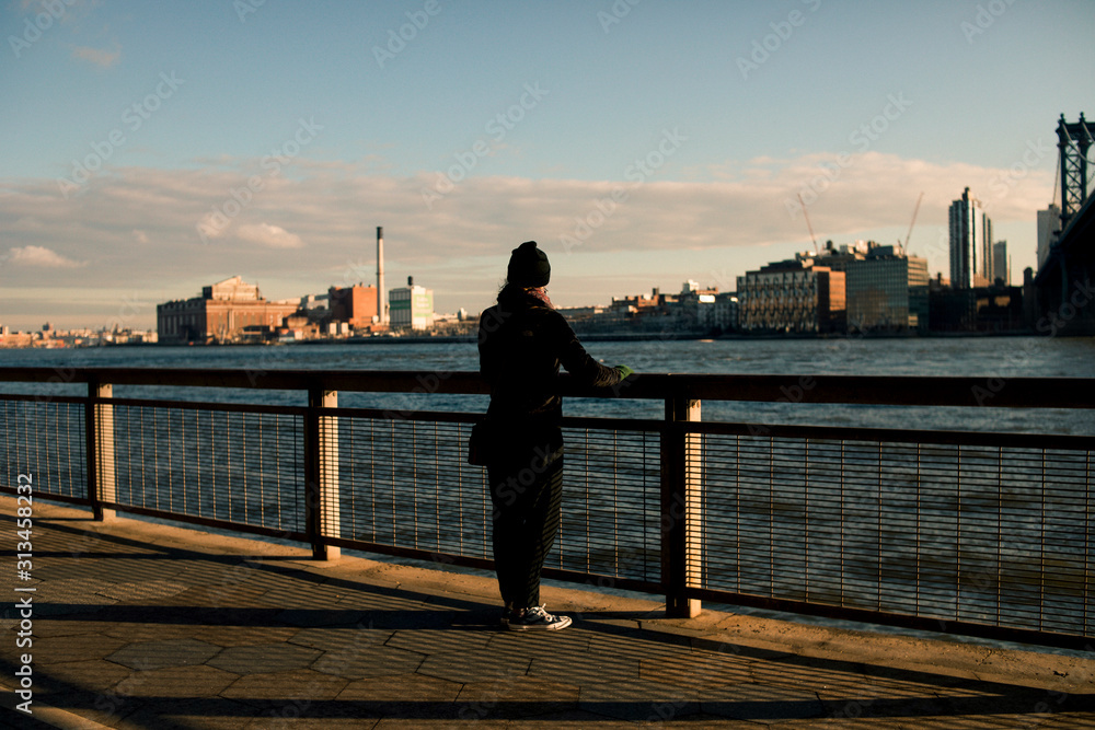 Young Woman Looking over the Hudson River in New York City