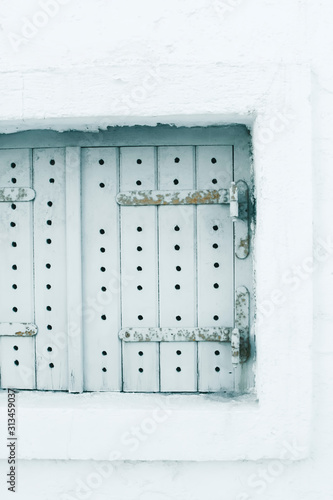 Old wooden window shutters in cold light. photo