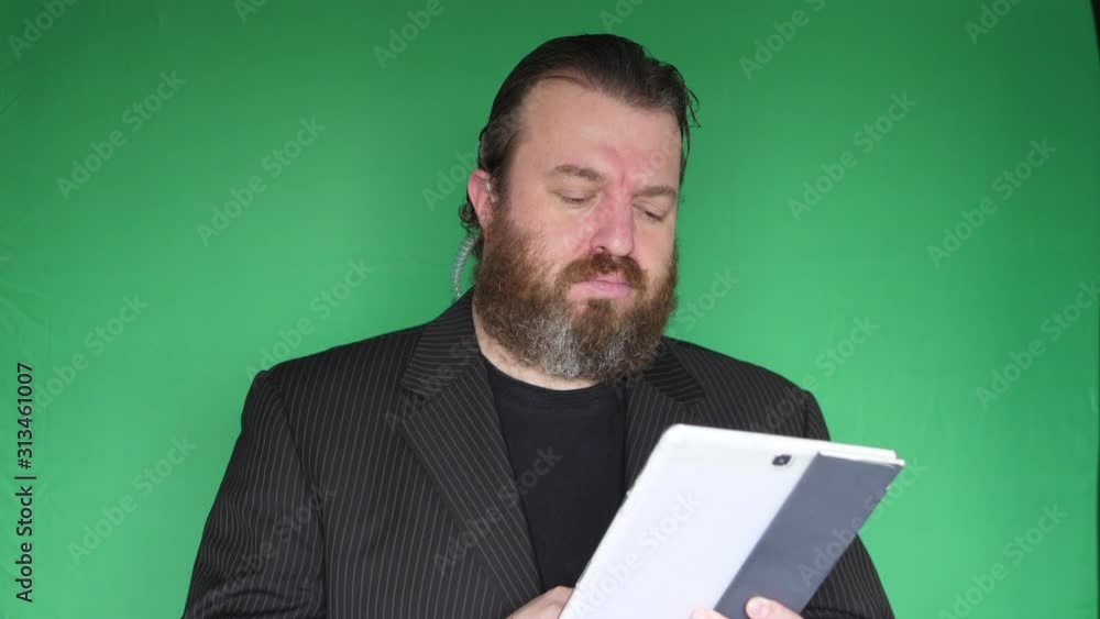 Portrait of bearded bouncer in front of green screen Portrait of bearded bouncer in front of green screen
