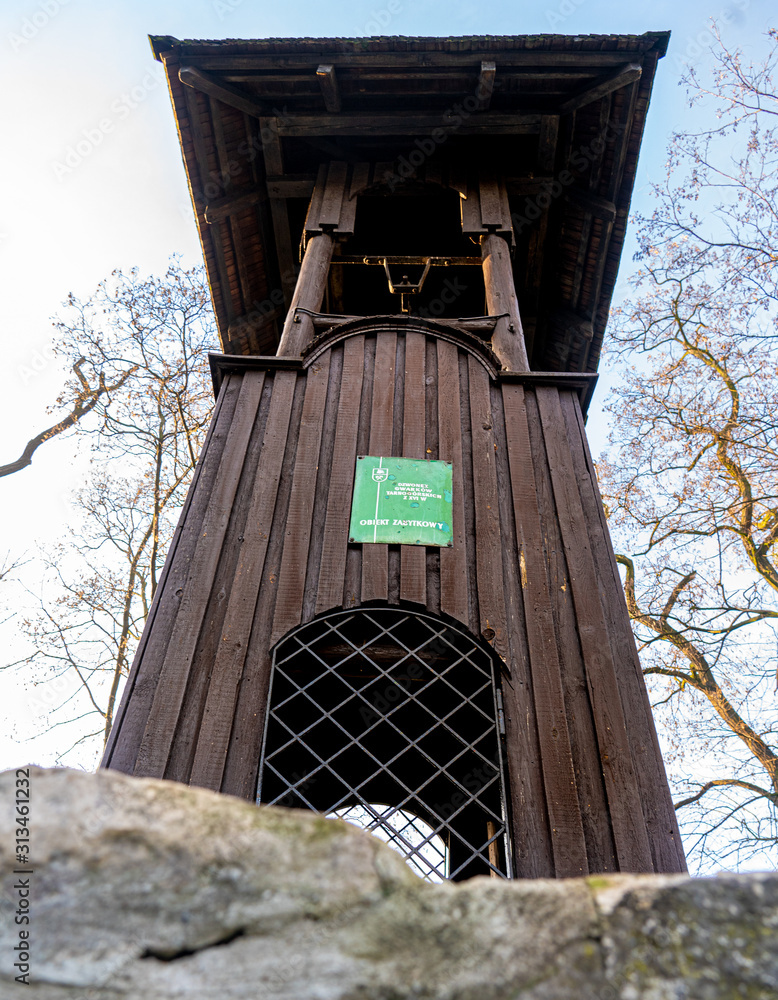 Old wooden belfry of the miners from the silver mine at the church of Piotr and Paweł in Tarowskie Góry - obrazy, fototapety, plakaty 