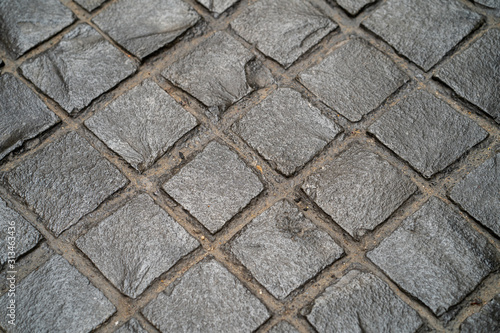 Paving road lined with gray stones