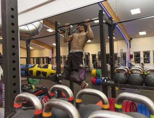 Close up view of a male doing pull-ups. Healthy lifestyle concept.  Enkoping. Sweden.  photo