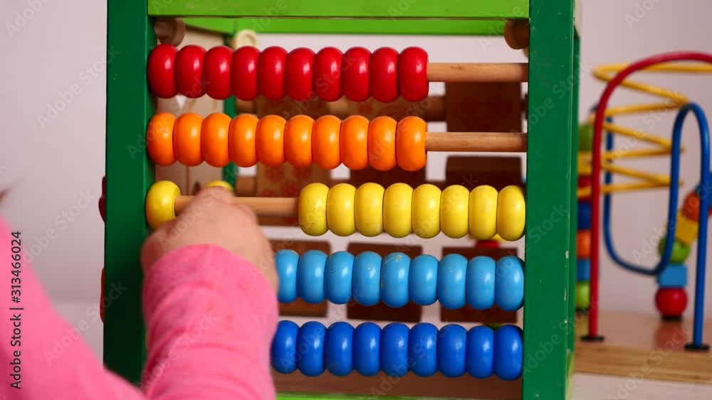 Child Learning to Count with Calculating Tool (Abacus) Child Learning to Count with Calculating Tool (Abacus)