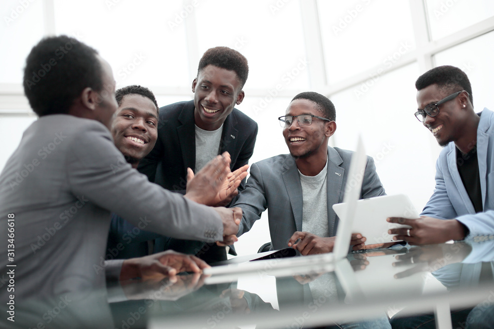 group of employees looking at the screen of a digital tablet. group of employees looking at the screen of a digital tablet.