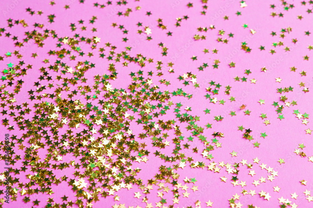 Glitter on a pink background. Celebration, party, birthday magic background. Creative minimal art concept