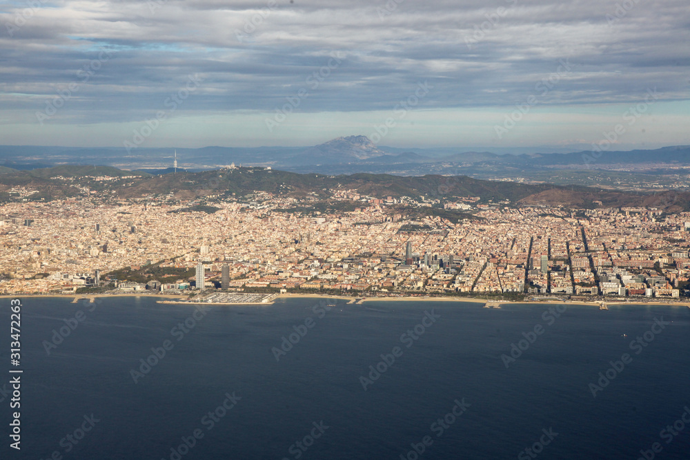 Barcelona city and beach seen from the aircraft. Spain