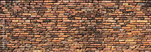 Beautiful brick wall that are not plastered background and texture. Panorama orange brick wall.