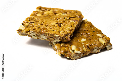 Crispy peanut jaggery bar on white background photo