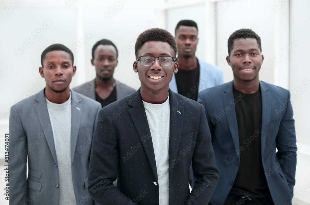 group of young business people standing in the office lobby. group of young business people standing in the office lobby.