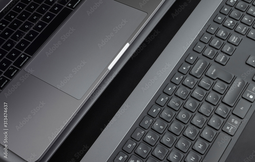 Close-up black keyboard keys and laptop