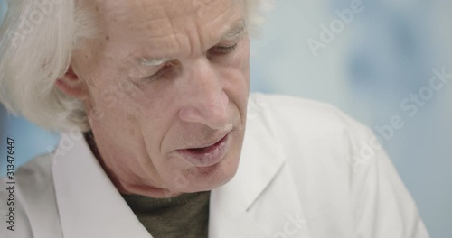 Wallpaper Mural Portrait of senior scientist working in laboratory Torontodigital.ca