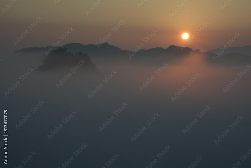 Beautiful glowing sea of fog from sunlight in a morning (over a valley)