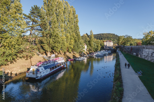 River with cruise ship in a sunny day in a French town © Sen