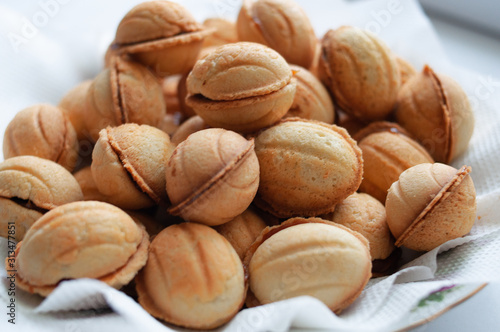 cookies nuts with condensed milk on a white background