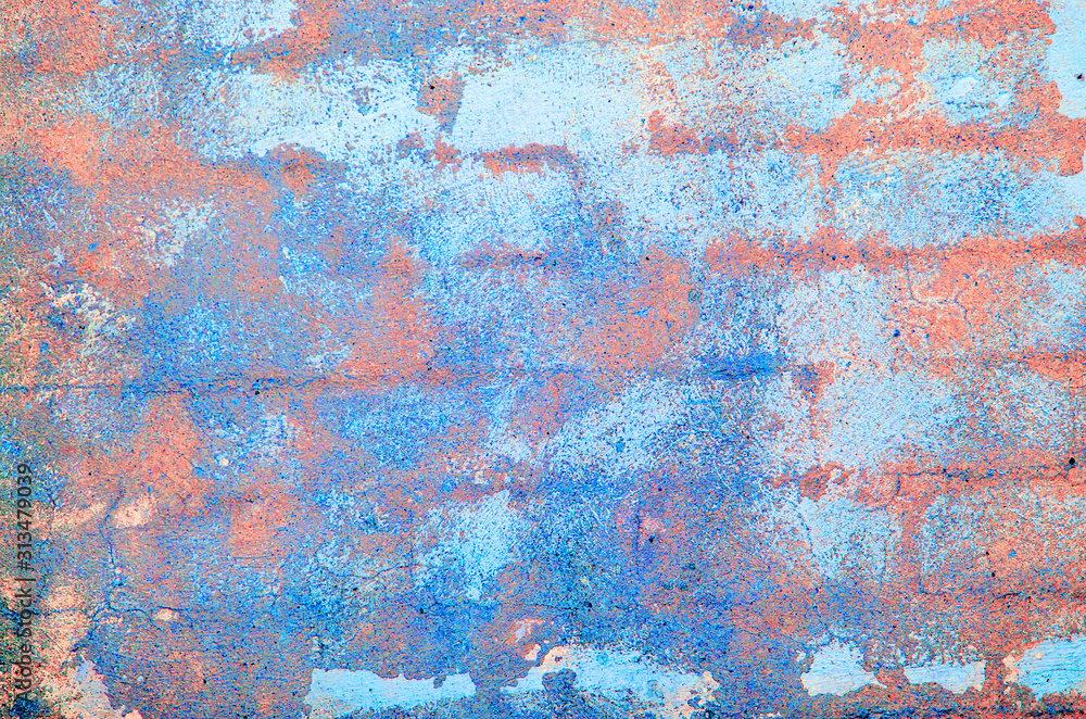 Old concrete wall. Peeling plaster on wall of house, building or fence surface. Toning in bright neon pink and blue colors. Modern urban backdrop. Copy space. Place for text. Selective focus image.