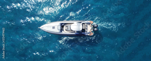 Aerial drone ultra wide photo of inflatable rib docked in tropical exotic bay © aerial-drone