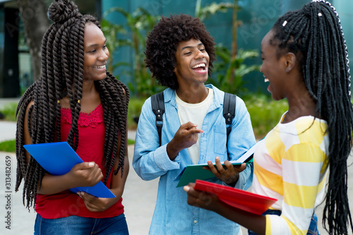 Group of happy african american male and female students photo