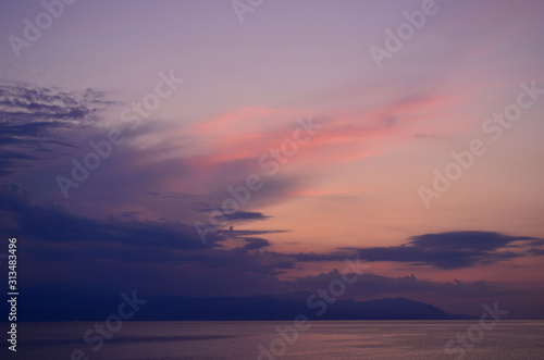 Beautiful sunset by the sea in Greece © ganeshaganesha