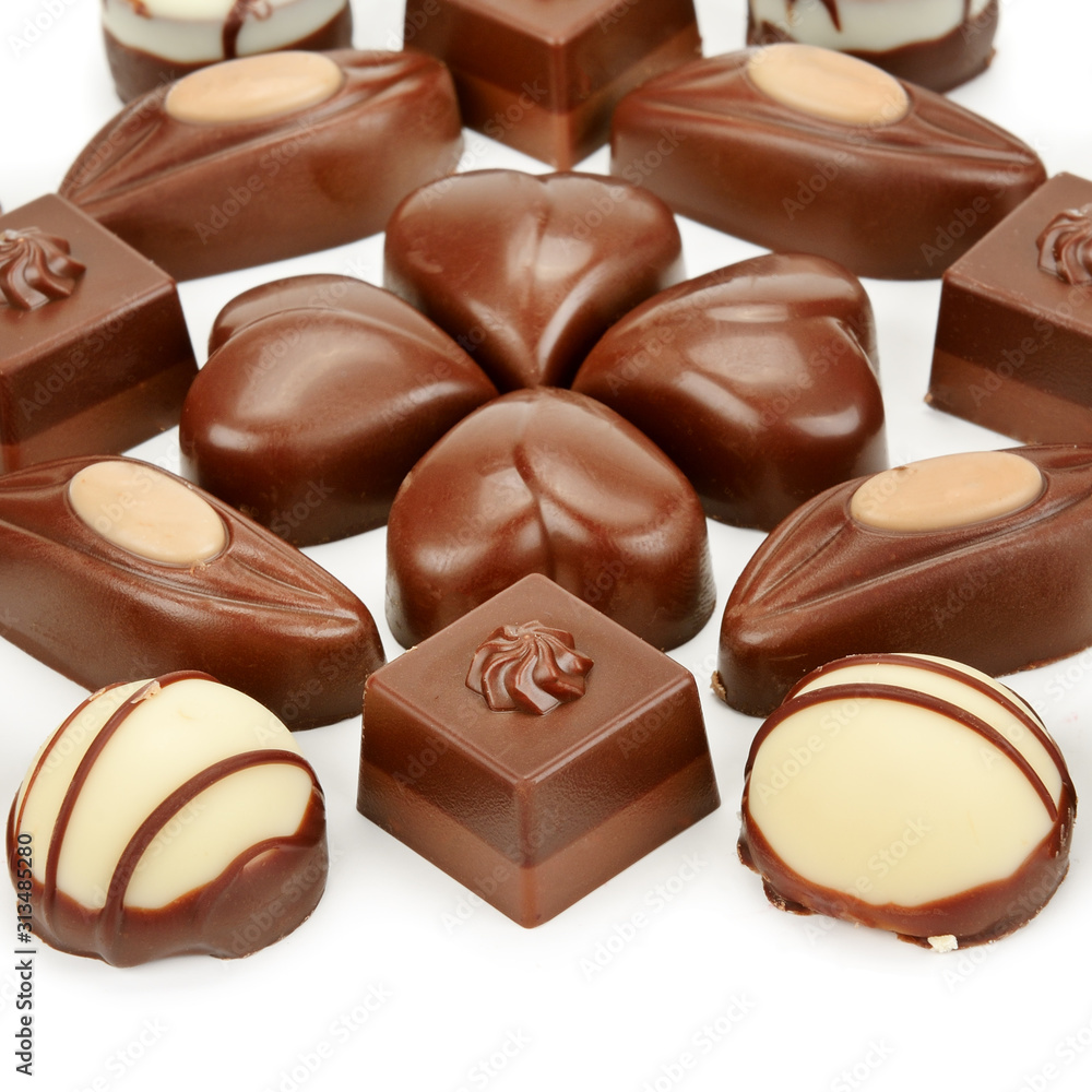 Various chocolate pralines isolated on white background. Various chocolate pralines isolated on white background.