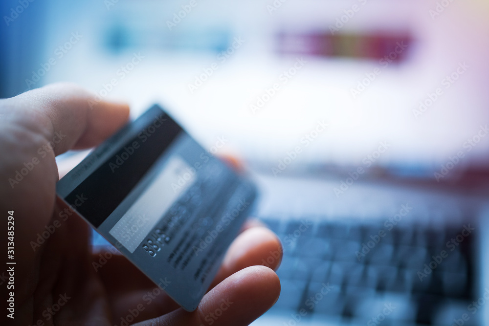 Laptop computer keyboard and credit card, online shopping, e-commerce concept Laptop computer keyboard and credit card, online shopping, e-commerce concept