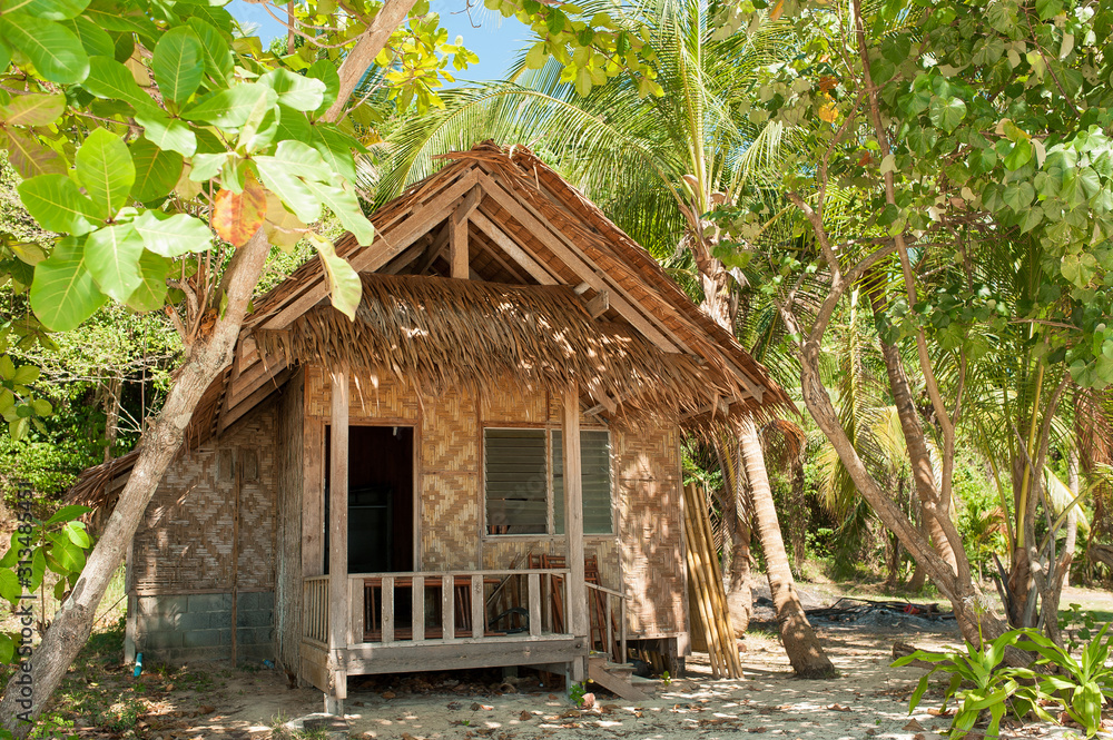 Beautiful beach house on tropical island in paradise. Villa Bungalow at Tropical beach shore Beautiful beach house on tropical island in paradise. Villa Bungalow at Tropical beach shore