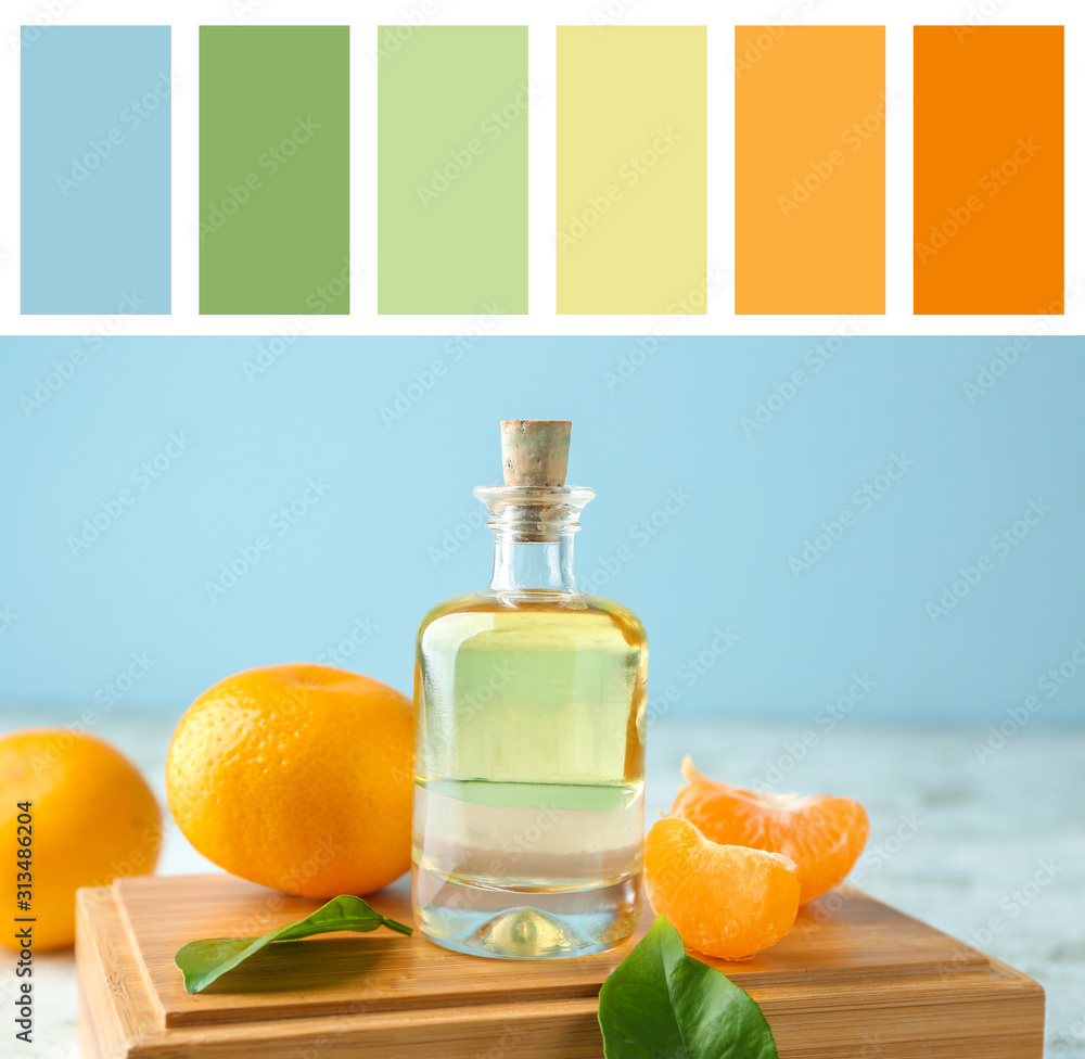 Bottle of tangerine essential oil on table Bottle of tangerine essential oil on table
