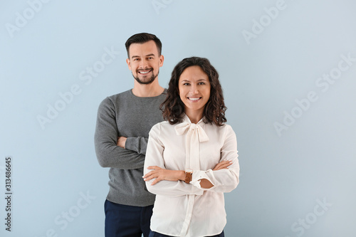 Portrait of young business people on color background