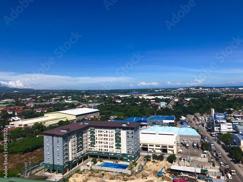 Aerial view of residential buildings and busy road just across from Lapu-Lapu bridge in Mandaue City photo