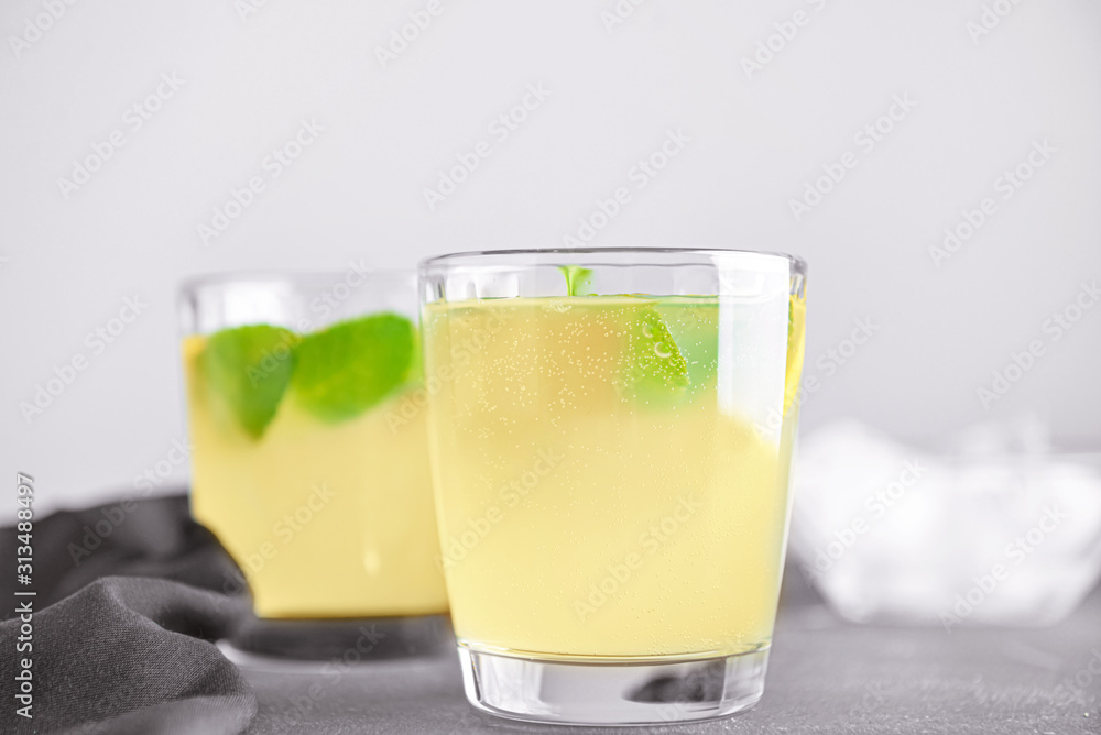 Glass of tasty lemonade on table Glass of tasty lemonade on table
