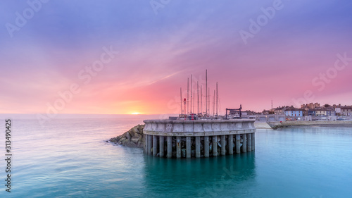 Valokuva Amazing sky on sunrise at Greystones yacht marina or harbour with boats in dry dock