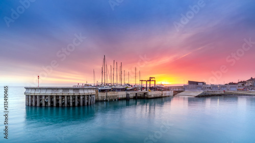 Amazing sky on sunrise at Greystones yacht marina or harbour with boats in dry dock. County Wicklow, Ireland © Dawid