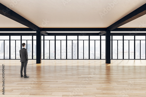 Businessman standing in modern interior