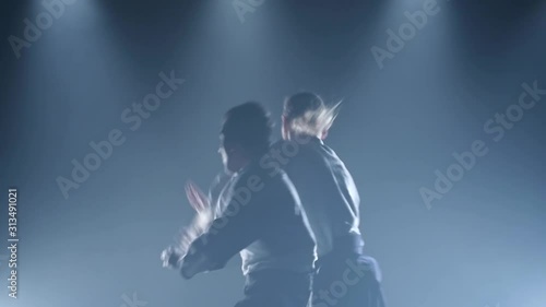 Wallpaper Mural Fight between two aikido fighters in the dojo. Slow motion. Close up. Torontodigital.ca