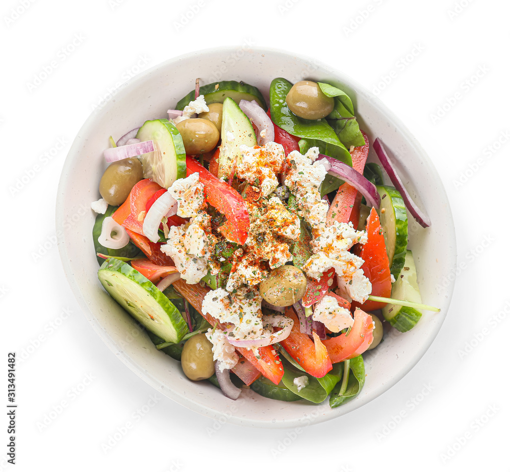 Bowl of tasty Greek salad on white background Bowl of tasty Greek salad on white background