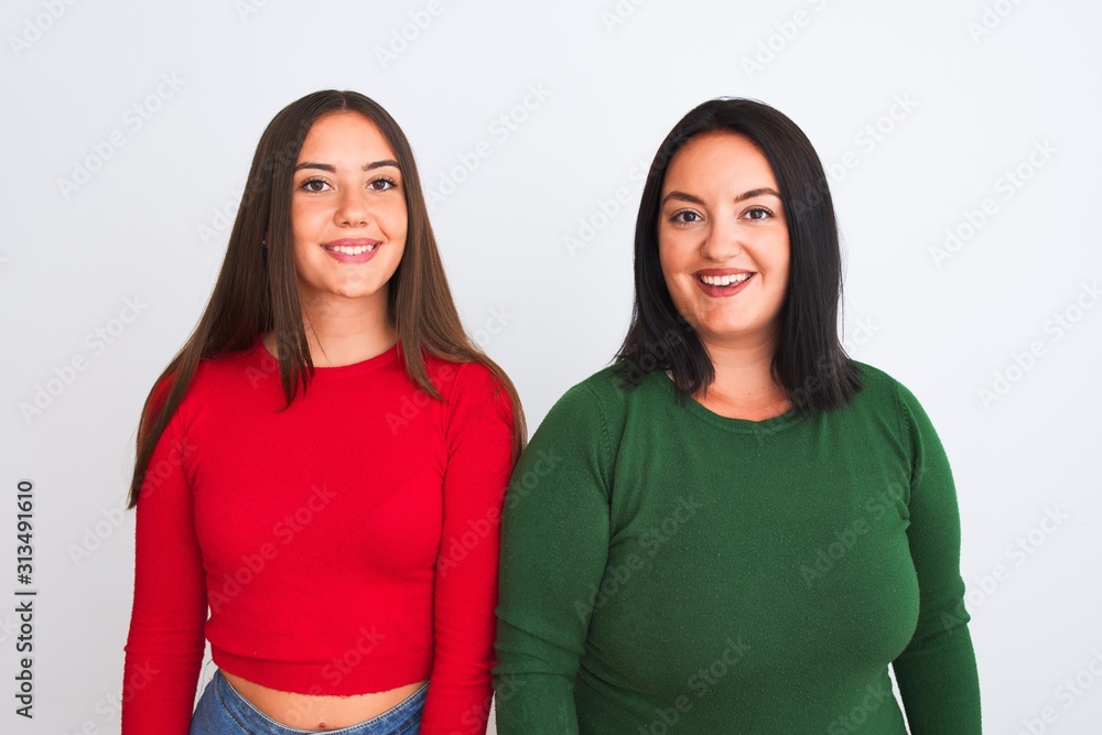 Young beautiful friends smiling happy and confident wearing casual clothes. Standing with a smile on face over isolated white background Young beautiful friends smiling happy and confident wearing casual clothes. Standing with a smile on face over isolated white background