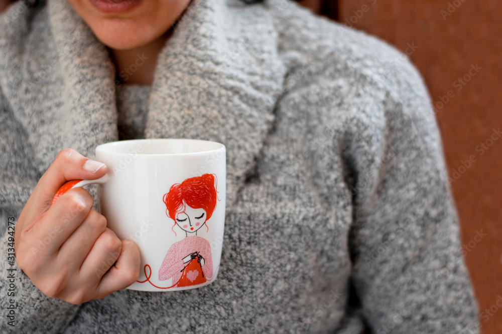 cup of chamomile, woman drinking cup of tea or coffee on wooden background cup of chamomile, woman drinking cup of tea or coffee on wooden background