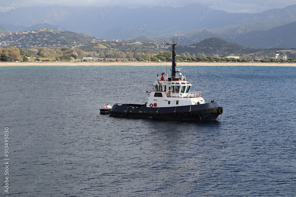 Sea tug on the roadstead of the port of Ajaccio island of Corsica. France, September 2019