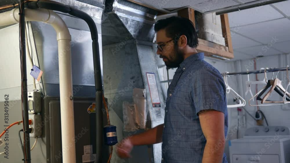 A homeowner is puzzled and frustrated over why his furnace is't working A homeowner is puzzled and frustrated over why his furnace is't working