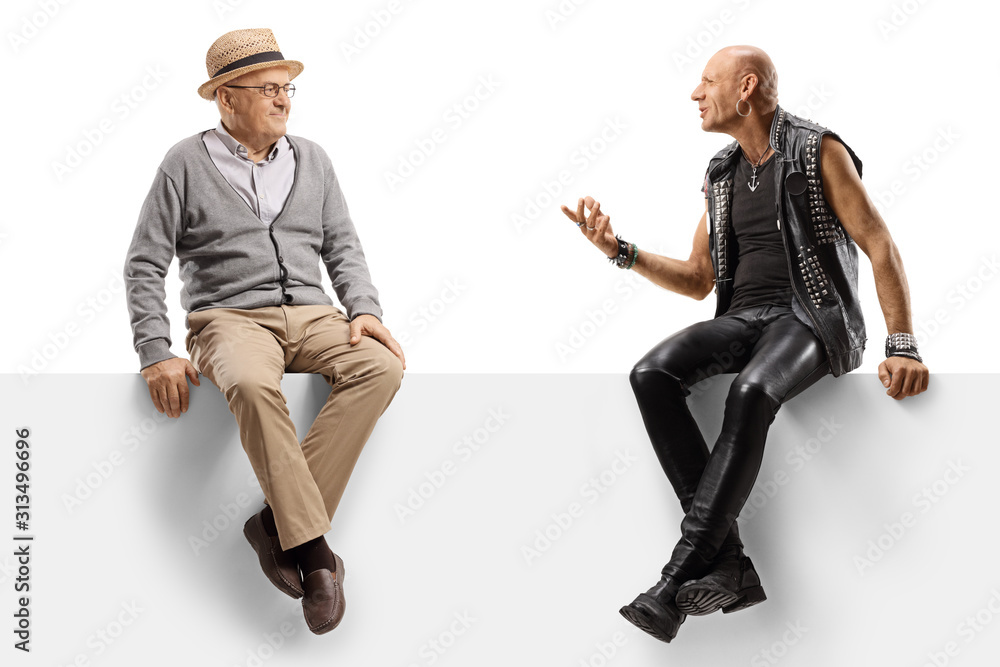 Punker talking to a senior man while sitting on a panel Punker talking to a senior man while sitting on a panel