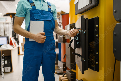 Plumber buying boiler with furnace, plumbering