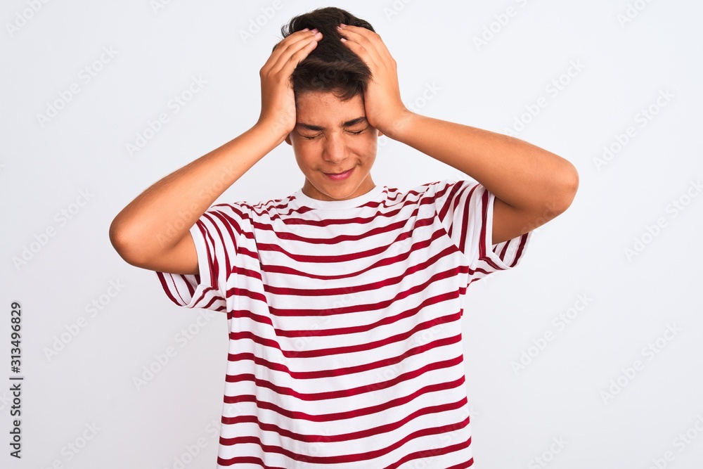 Handsome teenager boy standing over white isolated background suffering from headache desperate and stressed because pain and migraine. Hands on head. Handsome teenager boy standing over white isolated background suffering from headache desperate and stressed because pain and migraine. Hands on head.