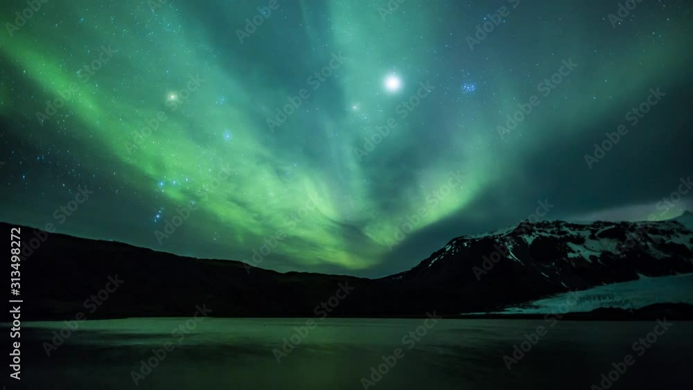 4K Aurora Borealis over a glacier lagoon in the arctic