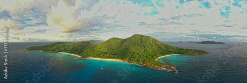 Fototapeta Naklejka Na Ścianę i Meble -  Landscape Seychelles Island La Digue in Indian ocean, beautiful blue sea with waves, sand beaches and green forest in the tropical paradise. Travel pictures