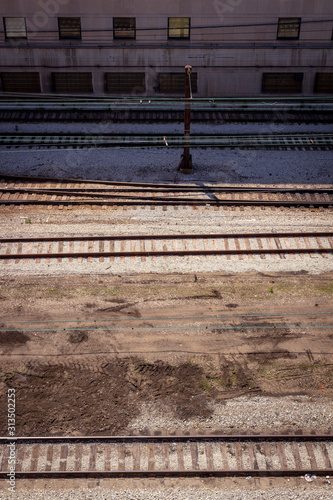 Multiple commuter railway tracks running horizontally seen from above