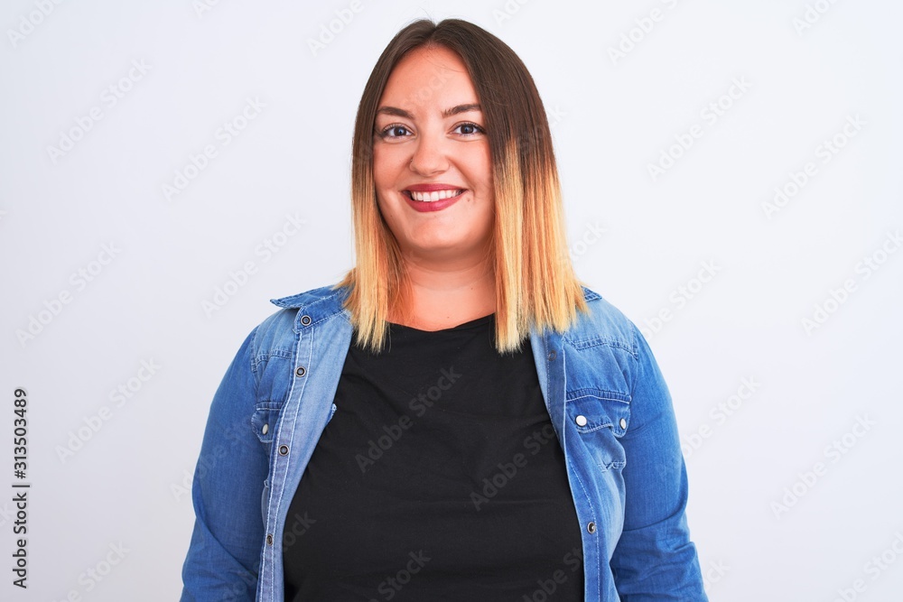 Young beautiful woman wearing denim shirt standing over isolated white background with a happy and cool smile on face. Lucky person. Young beautiful woman wearing denim shirt standing over isolated white background with a happy and cool smile on face. Lucky person.